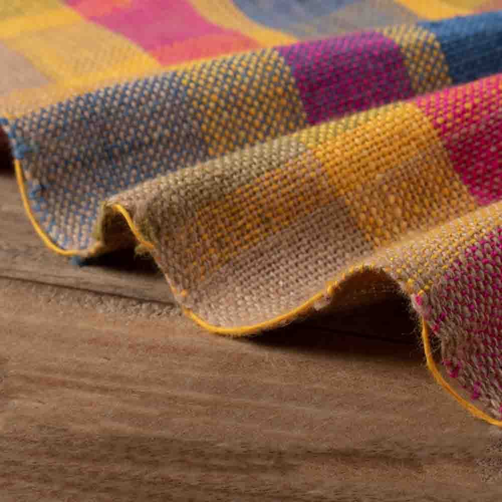 Multicolor check khadi fabric draped to highlight its soft texture and handwoven check design