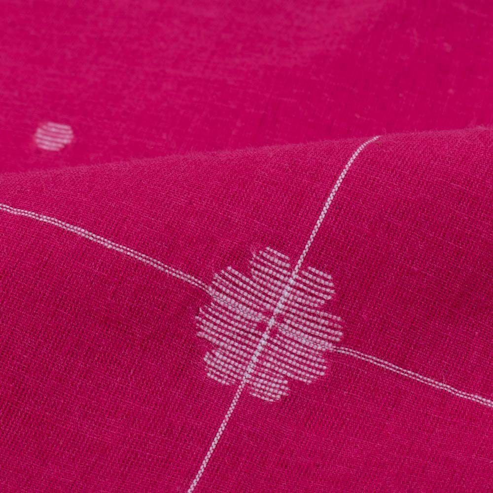 Red plain cotton Jamdani fabric with white flower motif folded for product display with other side