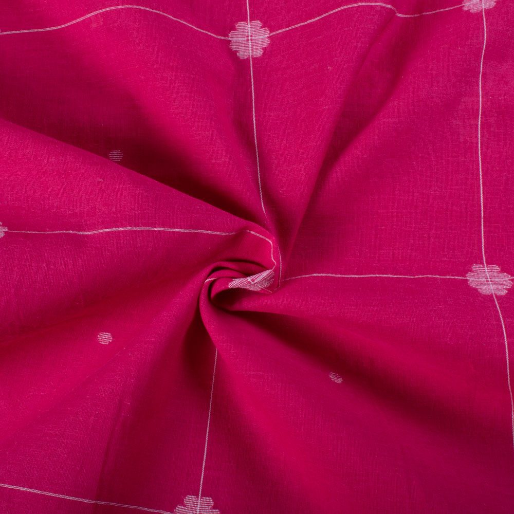 Twisted view of red plain cotton Jamdani fabric with white flower motif showing drape and flexibility