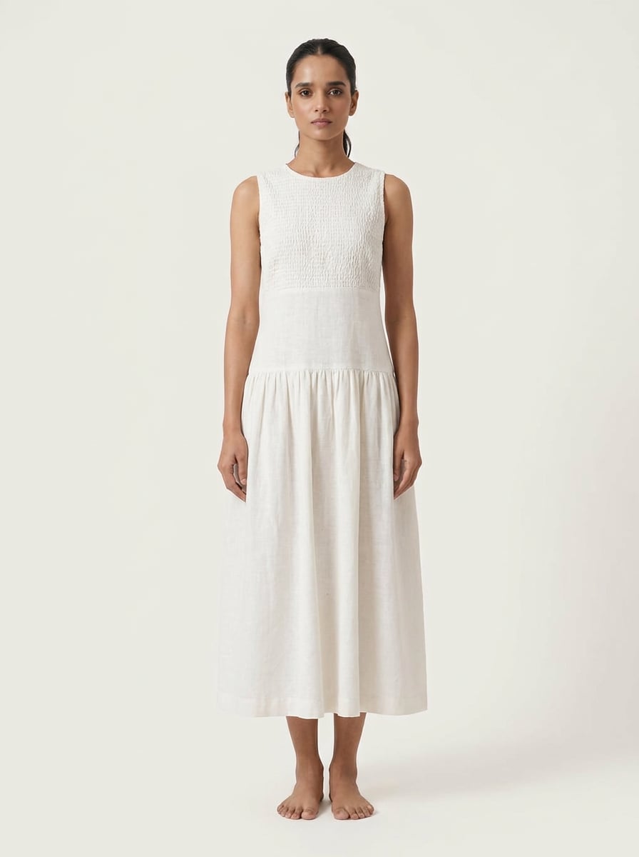 Front view of Smocked Chest Dropped Waist Midi Dress in handspun and handwoven khadi fabric