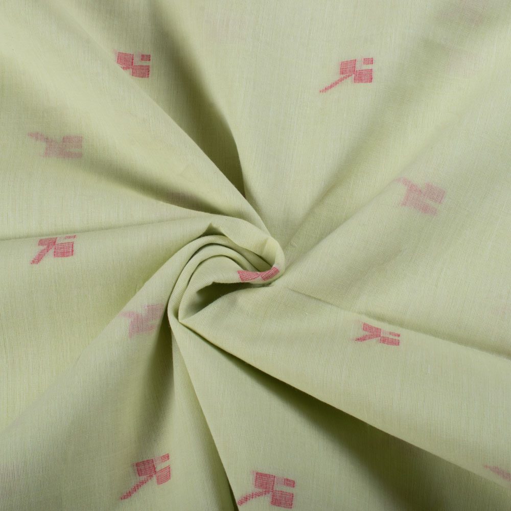 Twisted view of green plain cotton Jamdani fabric with red geometric motif showing drape and flexibility