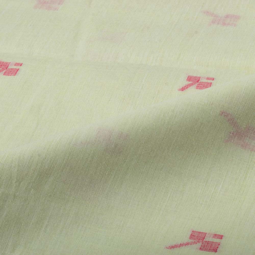 Green plain cotton Jamdani fabric draped to highlight its soft texture and red geometric motif design