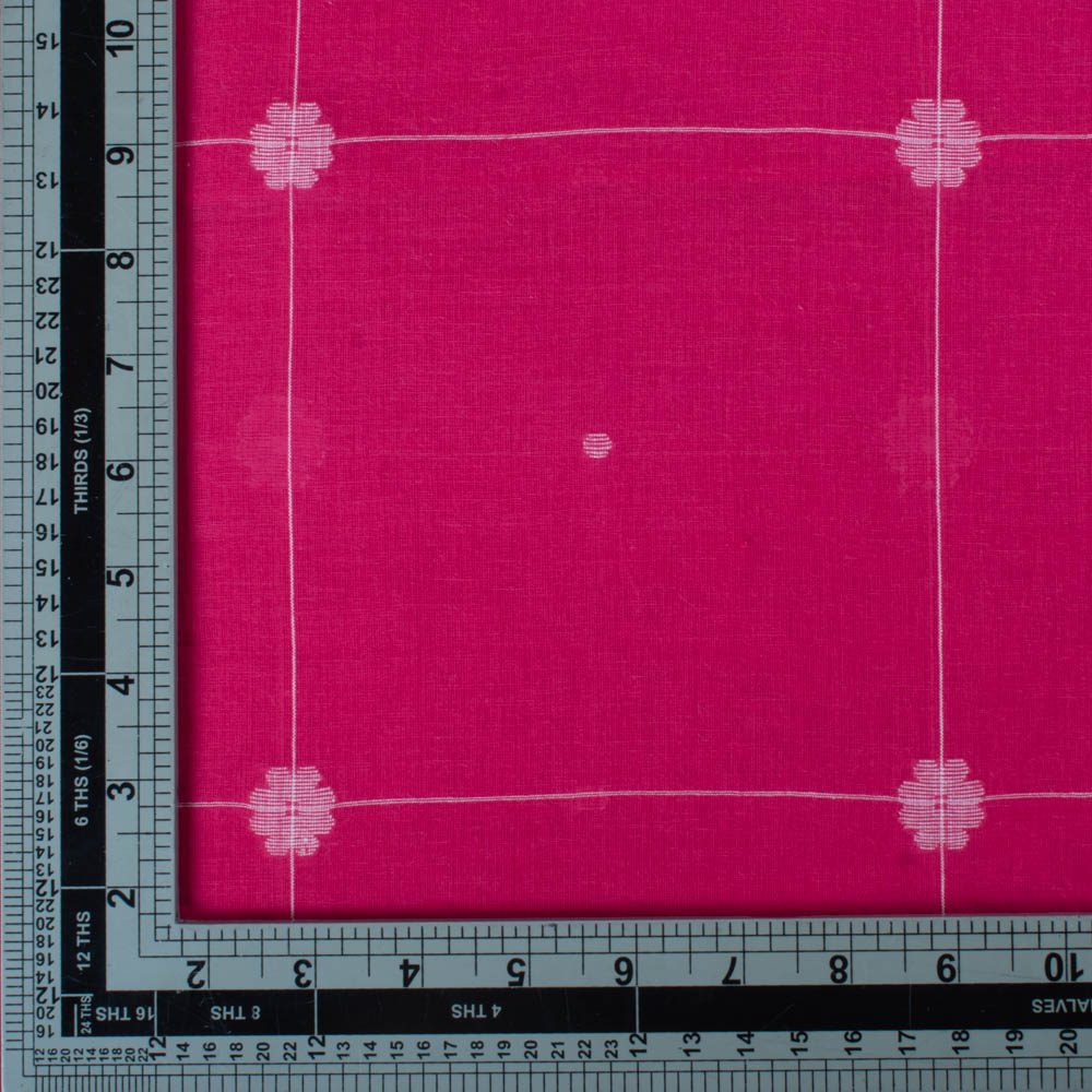 Red plain cotton Jamdani fabric with white flower motif folded for product display with other side