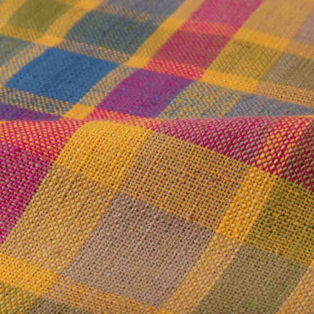 Full-width view of multicolor check khadi fabric with repeating handwoven check pattern
