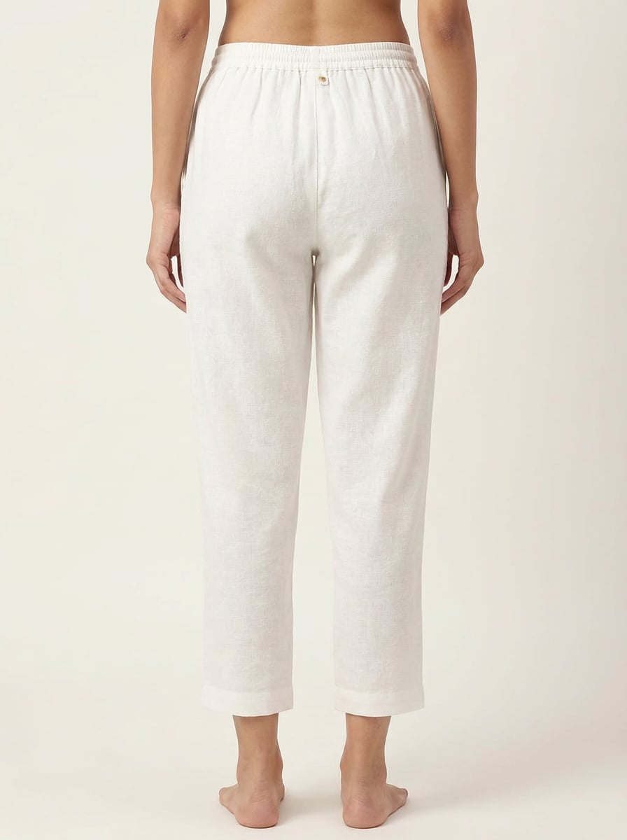 Back view of narrow fit ankle pants with drawstring in handspun and handwoven khadi fabric.