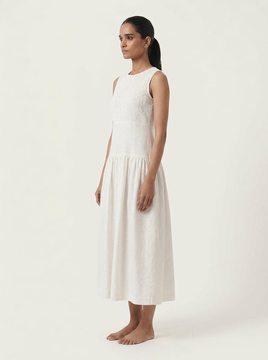 Side view of Smocked Chest Dropped Waist Midi Dress in handspun and handwoven khadi fabric